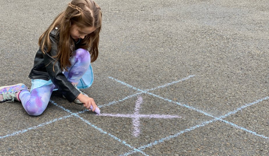 X marks the spot drawn with sidewalk chalk